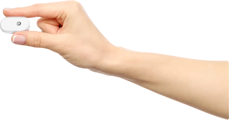 Fingers holding the small GS1 sensor to show its size
