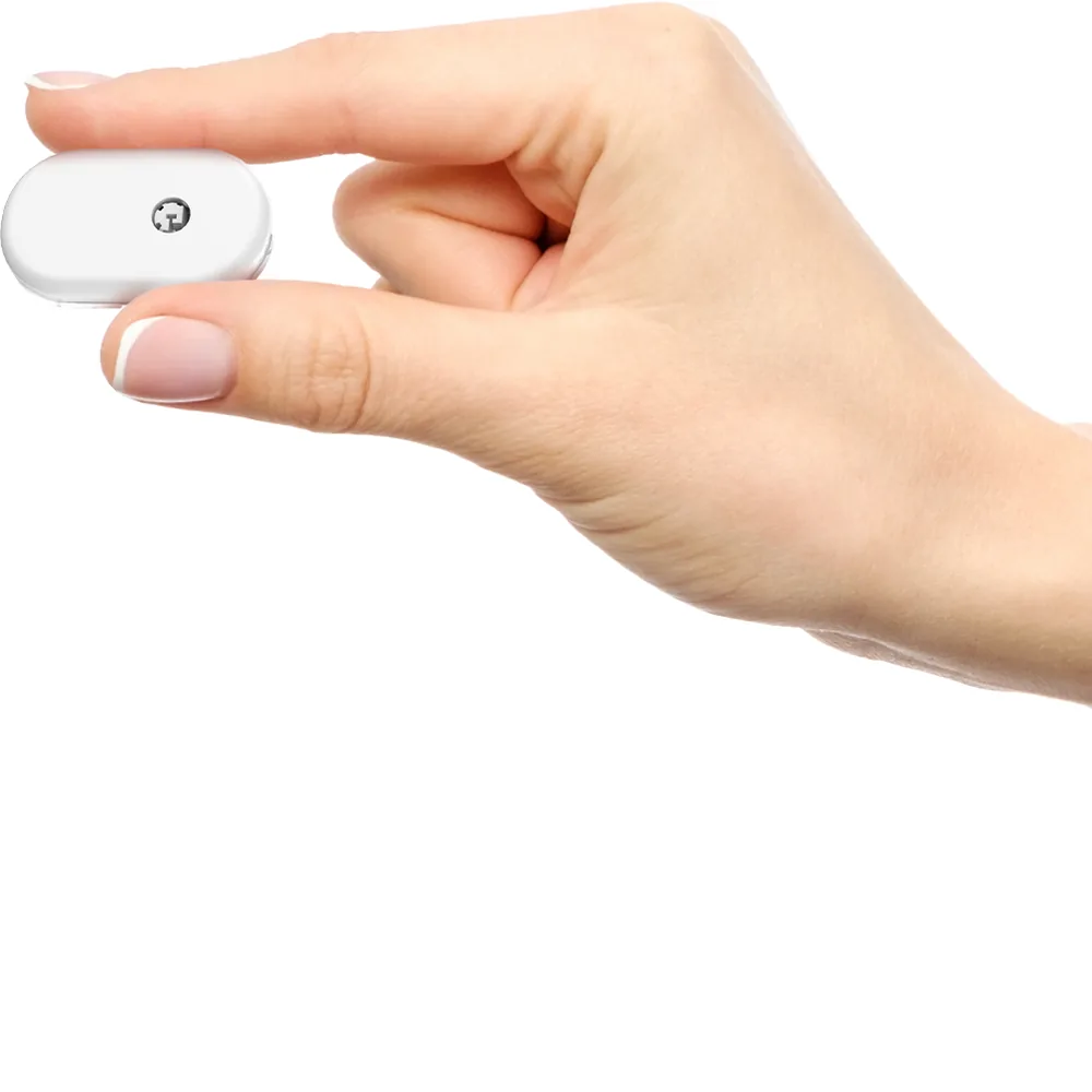 Sibionics GS1 sensor held between two fingers to show its small size